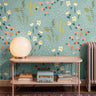 Friendly bright florals on teal blue background in dusty pink living room