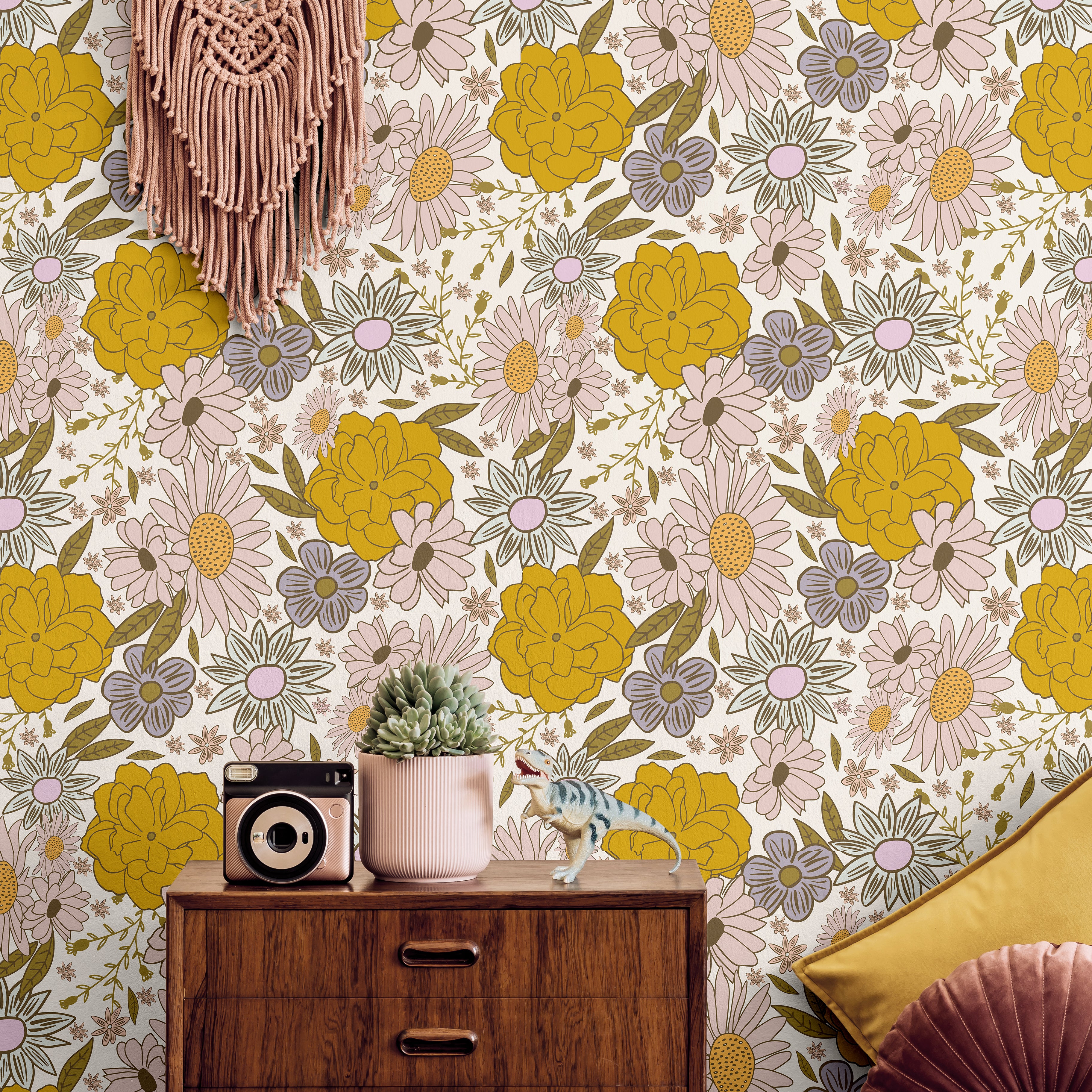 Golden yellow and pink flowers with dark wood in a boho living room