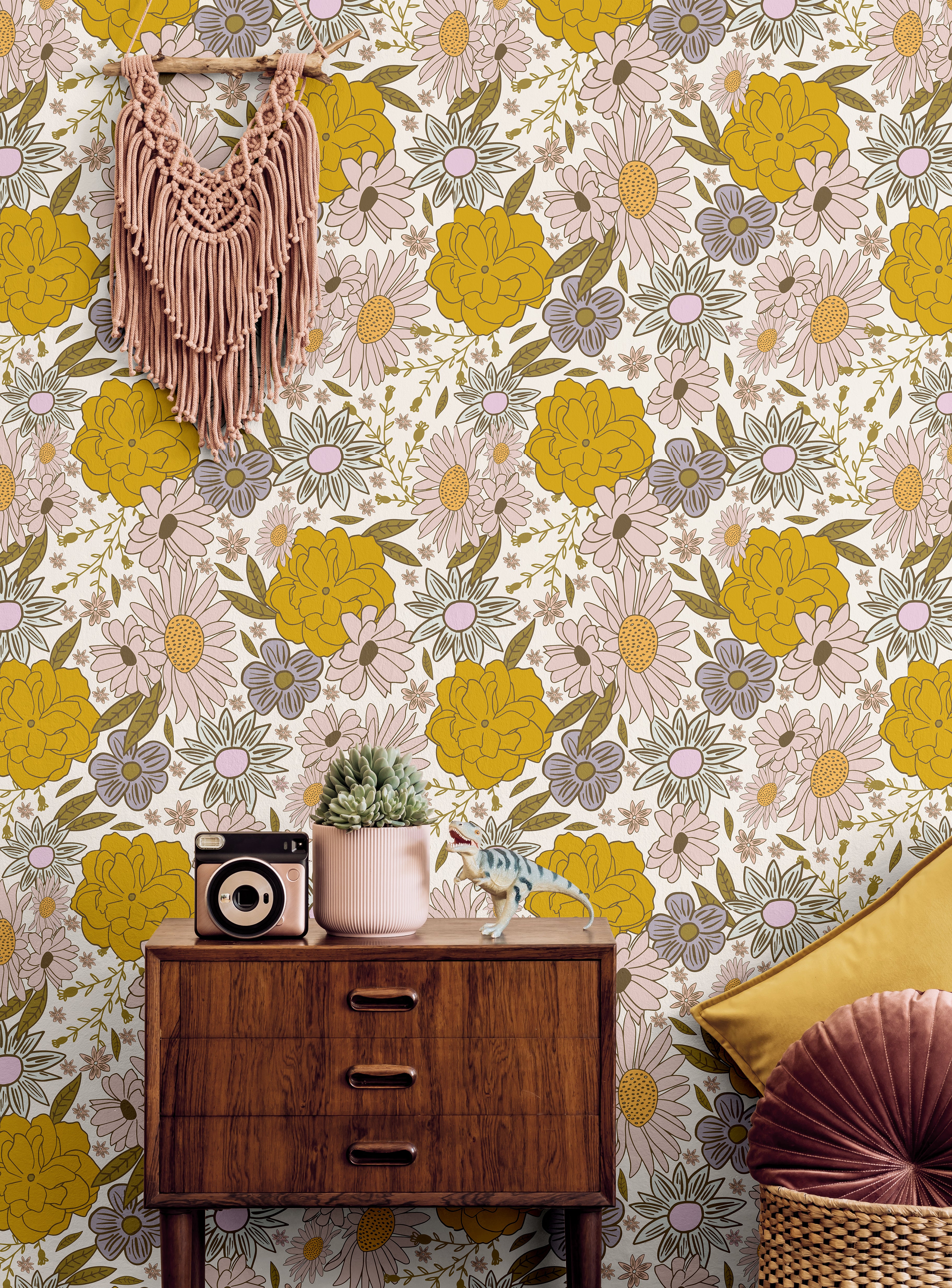Golden yellow and pink flowers with dark wood in a boho living room