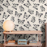 Black butterflies on cream background in mid-century modern interior