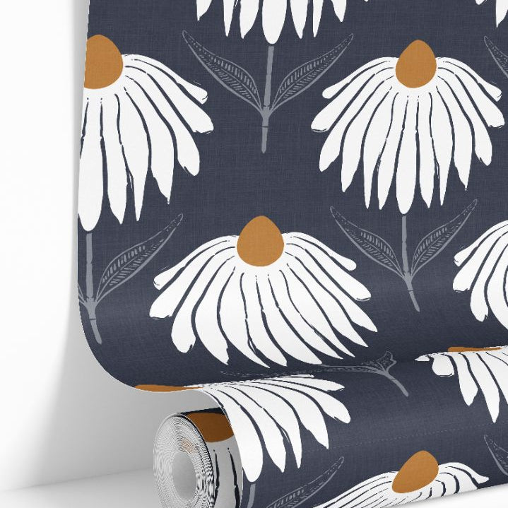White floral wallpaper roll with ochre centers on deep navy linen background