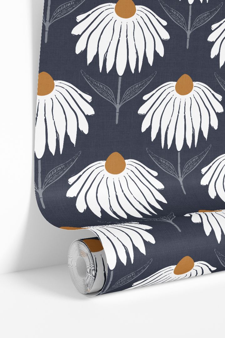 White floral wallpaper roll with ochre centers on deep navy linen background