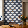 Dining room with Chantelune Noir Floral Wallpaper featuring bold white petals and warm wood tones