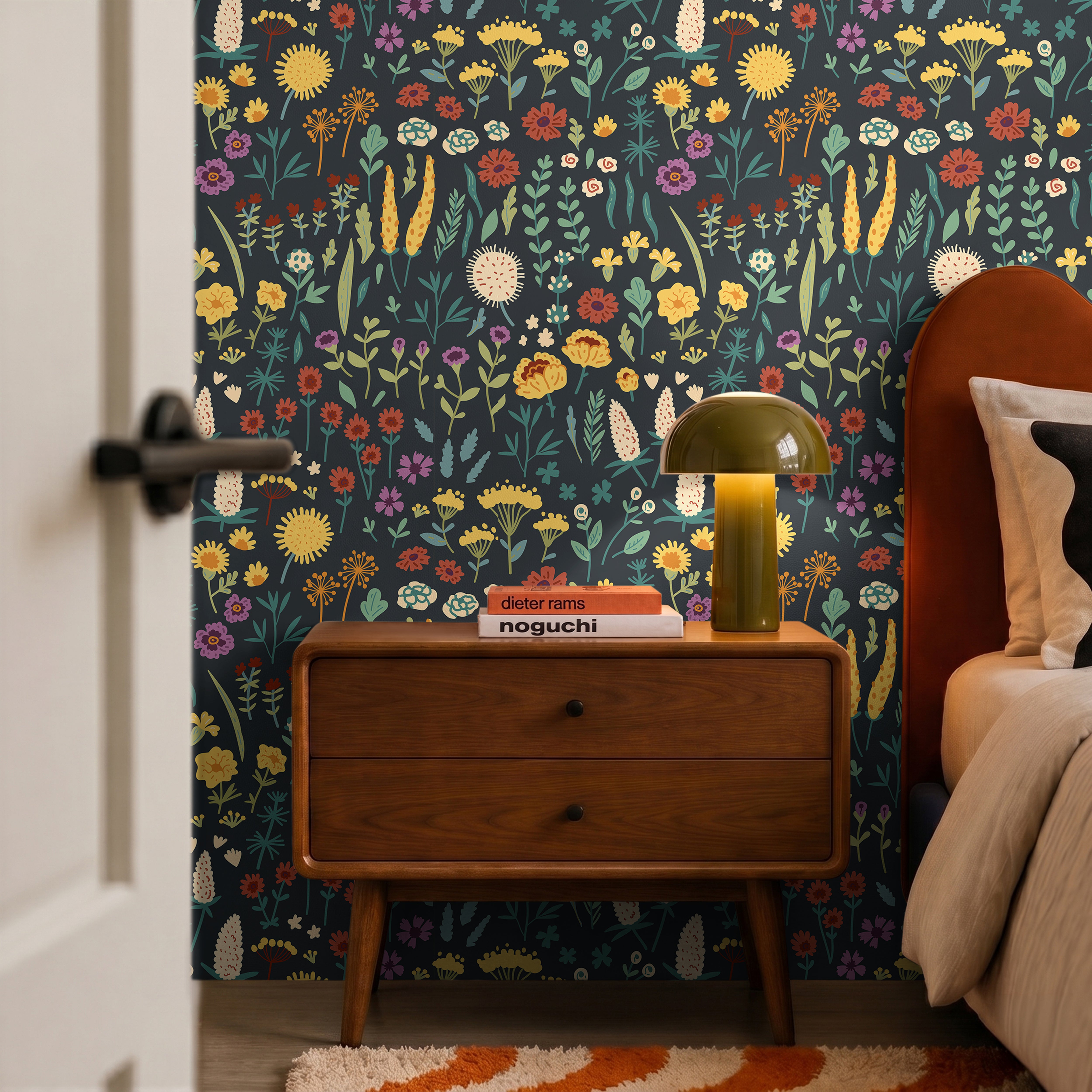 Dark wildflower florals with bright blooms on dark blue green background in modern mid century bedroom
