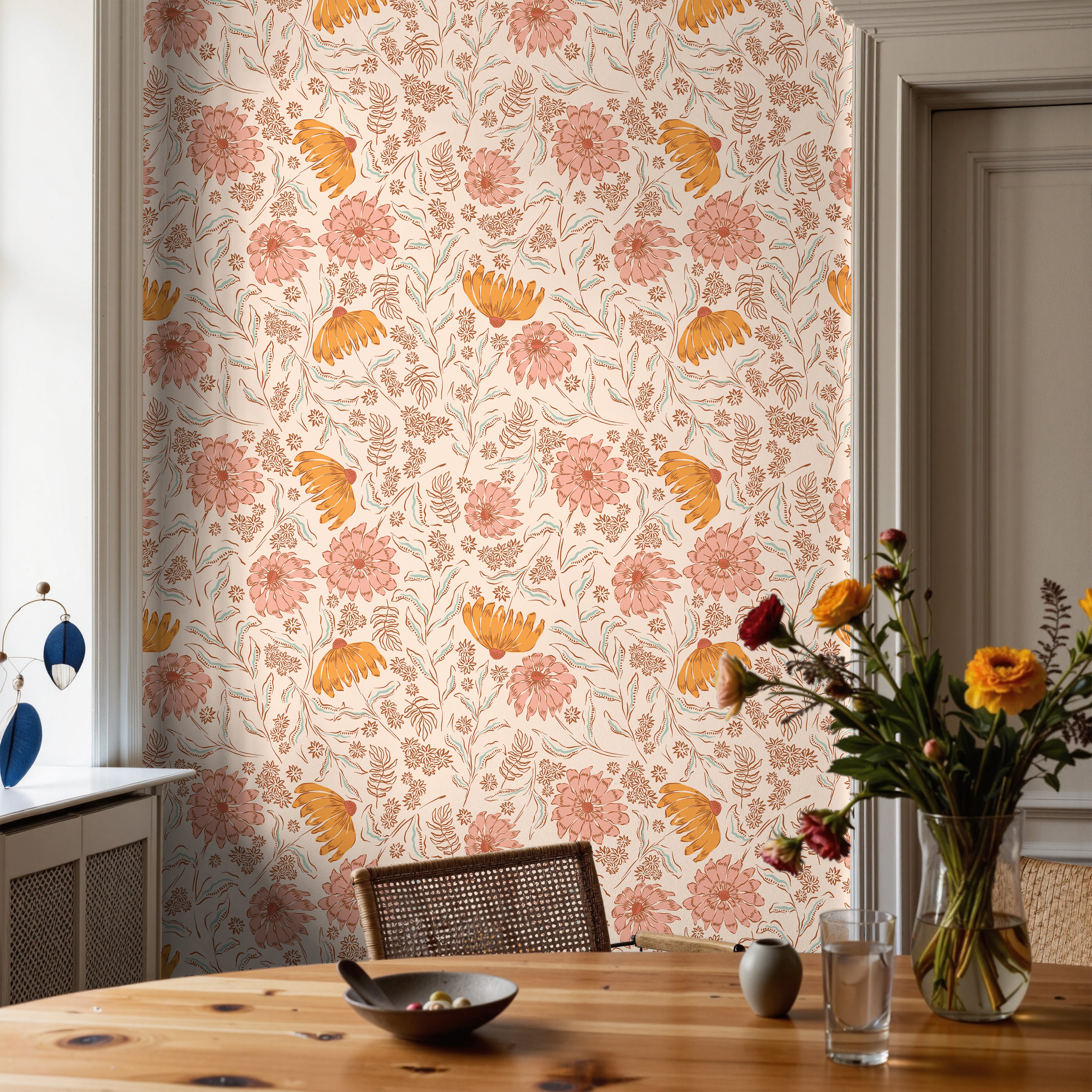 pink and orange floral motif wallcovering styled in warm dining room