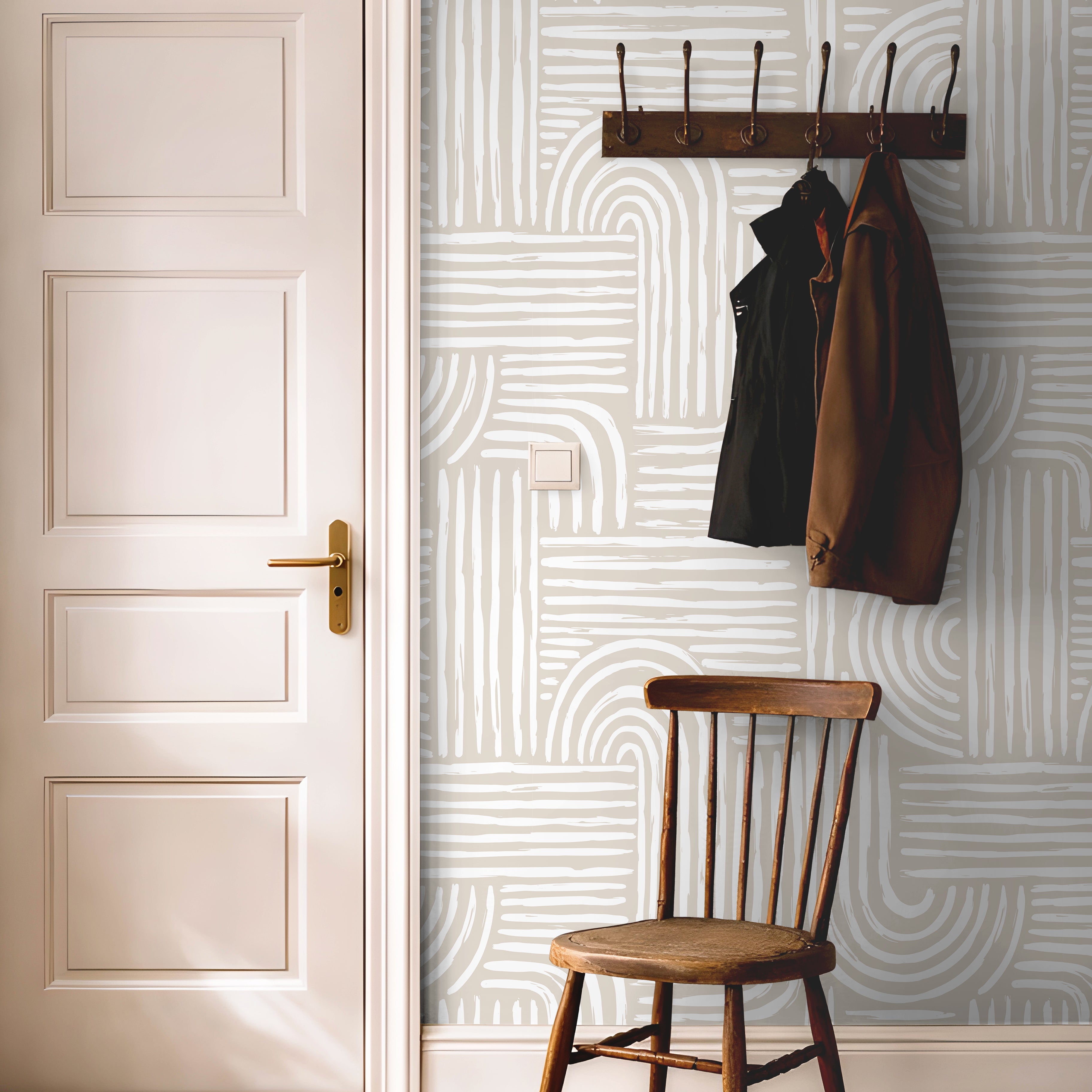 Cream and white art deco lined wallcovering in bright hallway with warm wooden accents