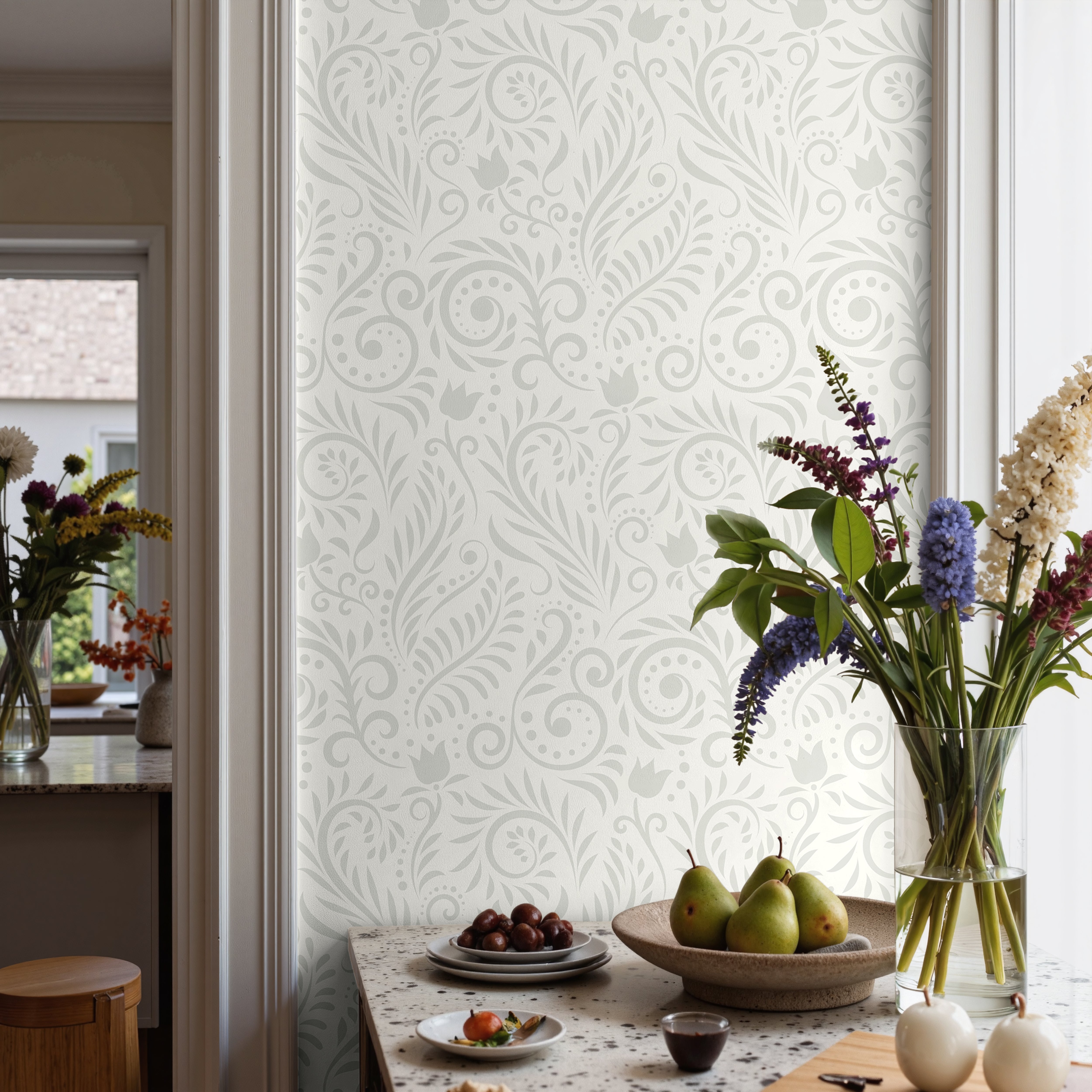 Ornamental neutral whimsical motifs with swirls, flowers and leaves in well lit natural dining countertop area