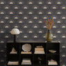 Golden suns peaking from the horizon with rays on dark charcoal background styled in modern living room interior