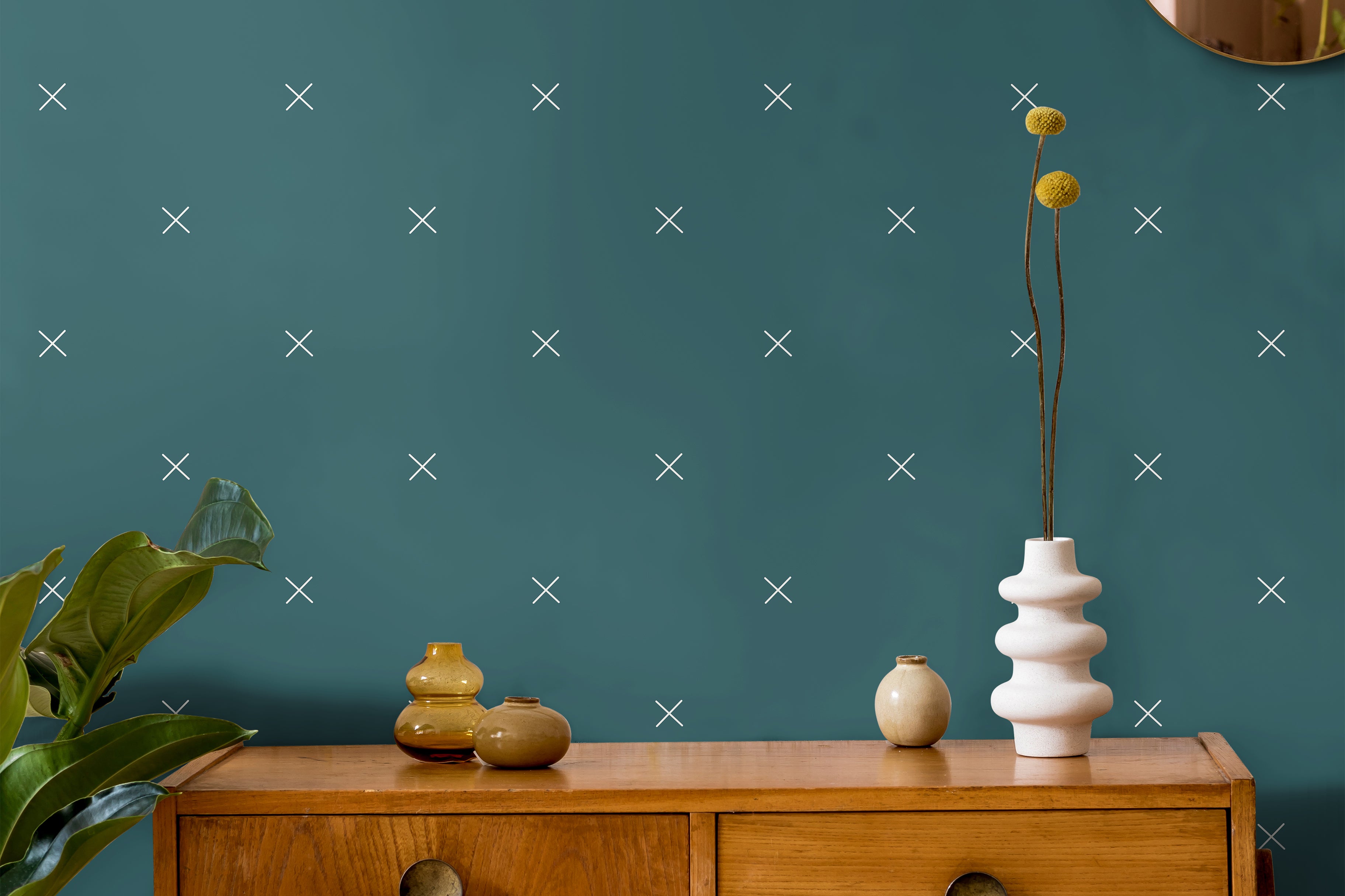 Dark teal with x pattern in warm wooden interior