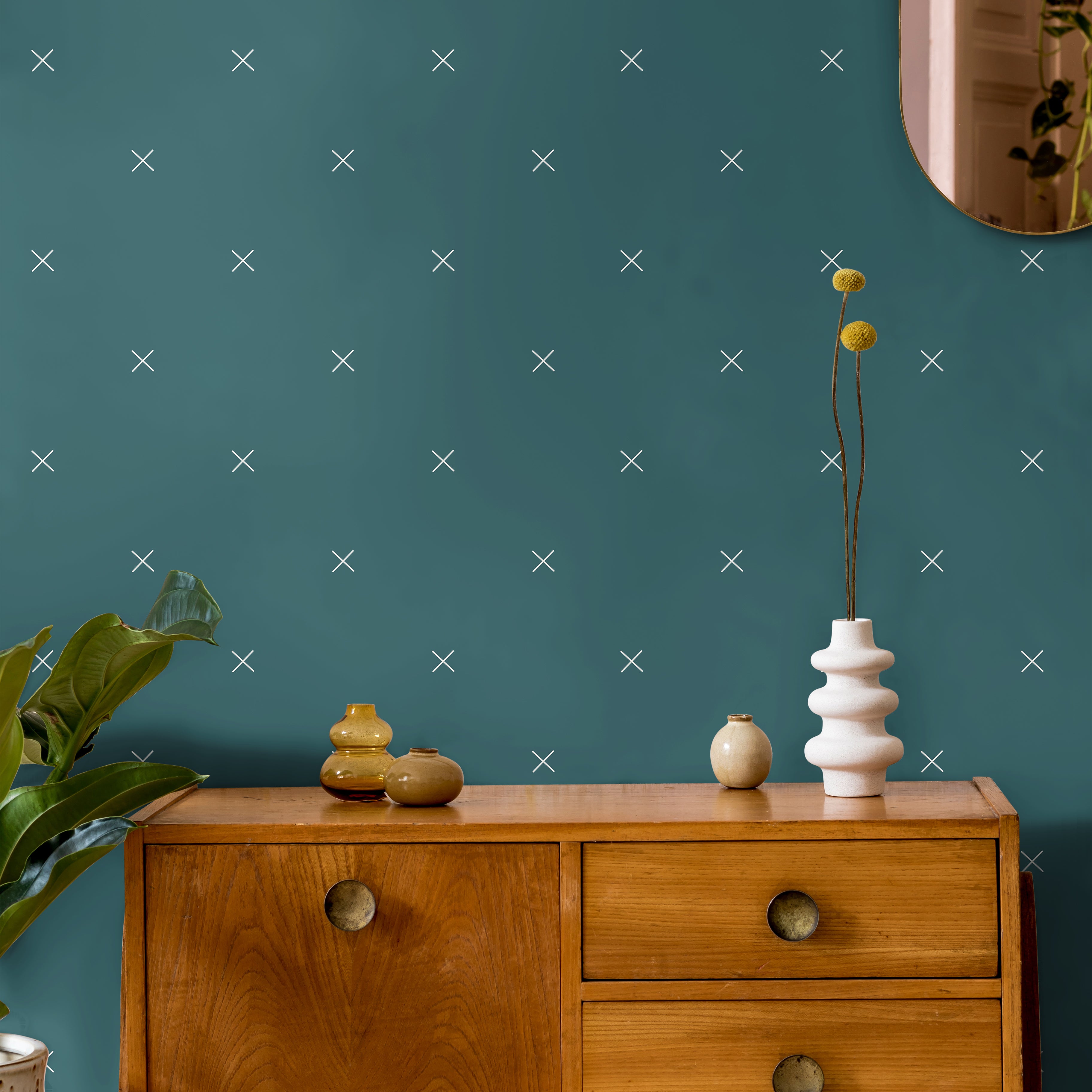 Dark teal with x pattern in warm wooden interior