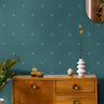 Dark teal with x pattern in warm wooden interior