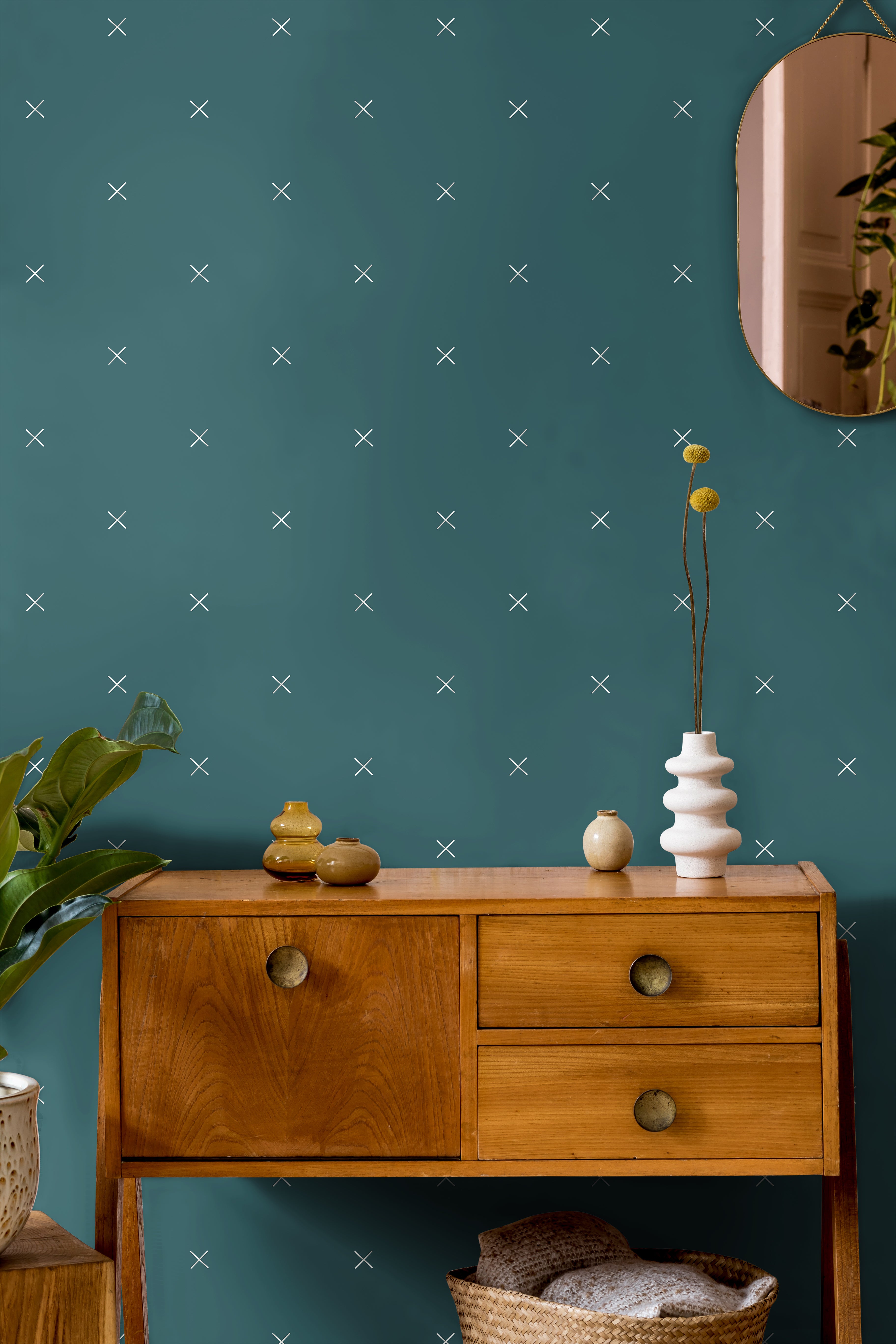 Dark teal with x pattern in warm wooden interior