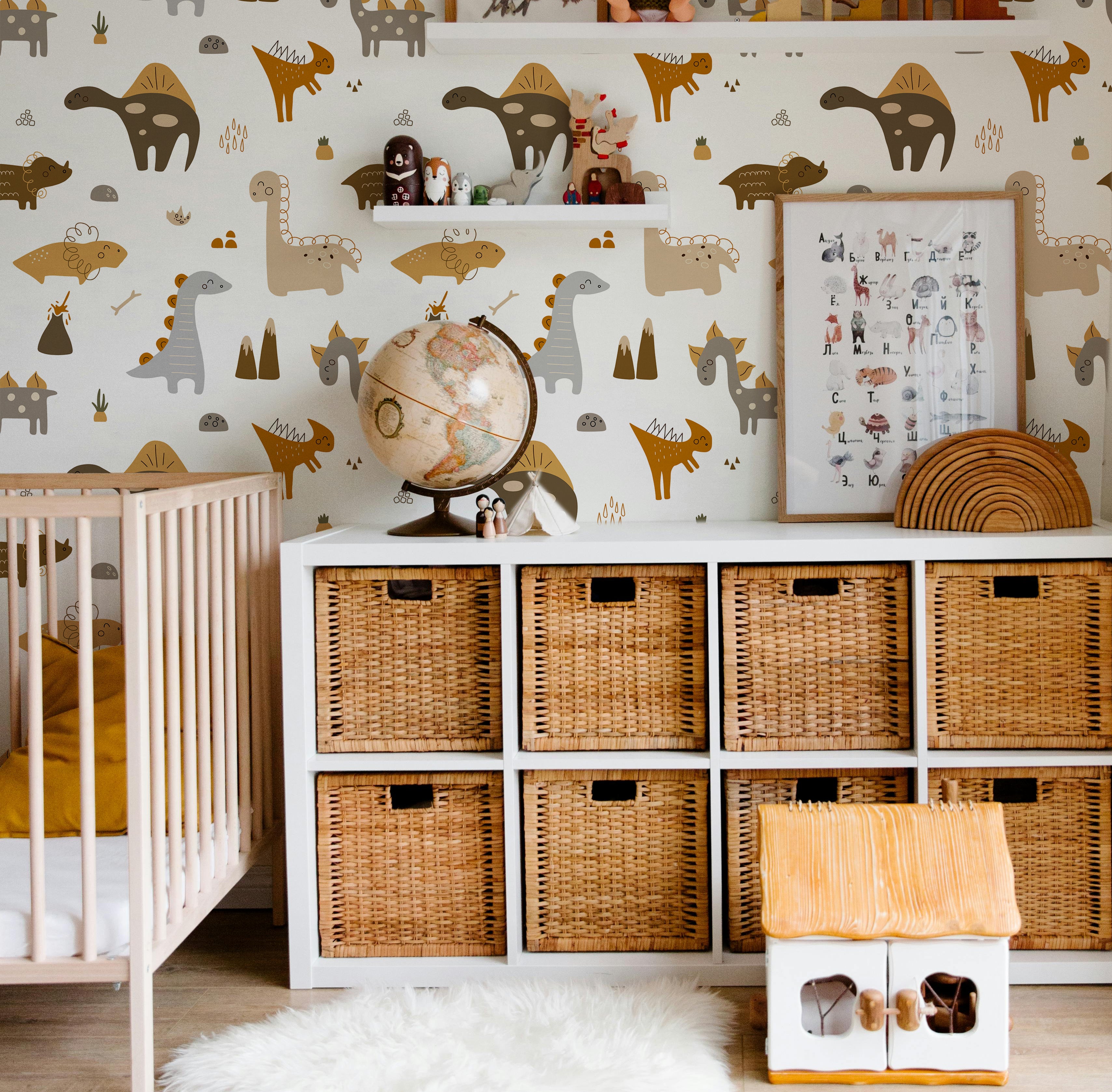 boho brown dinosaurs with mountains and volcanos and bones in kids nursery play room with cube shelf and wicker baskets 
