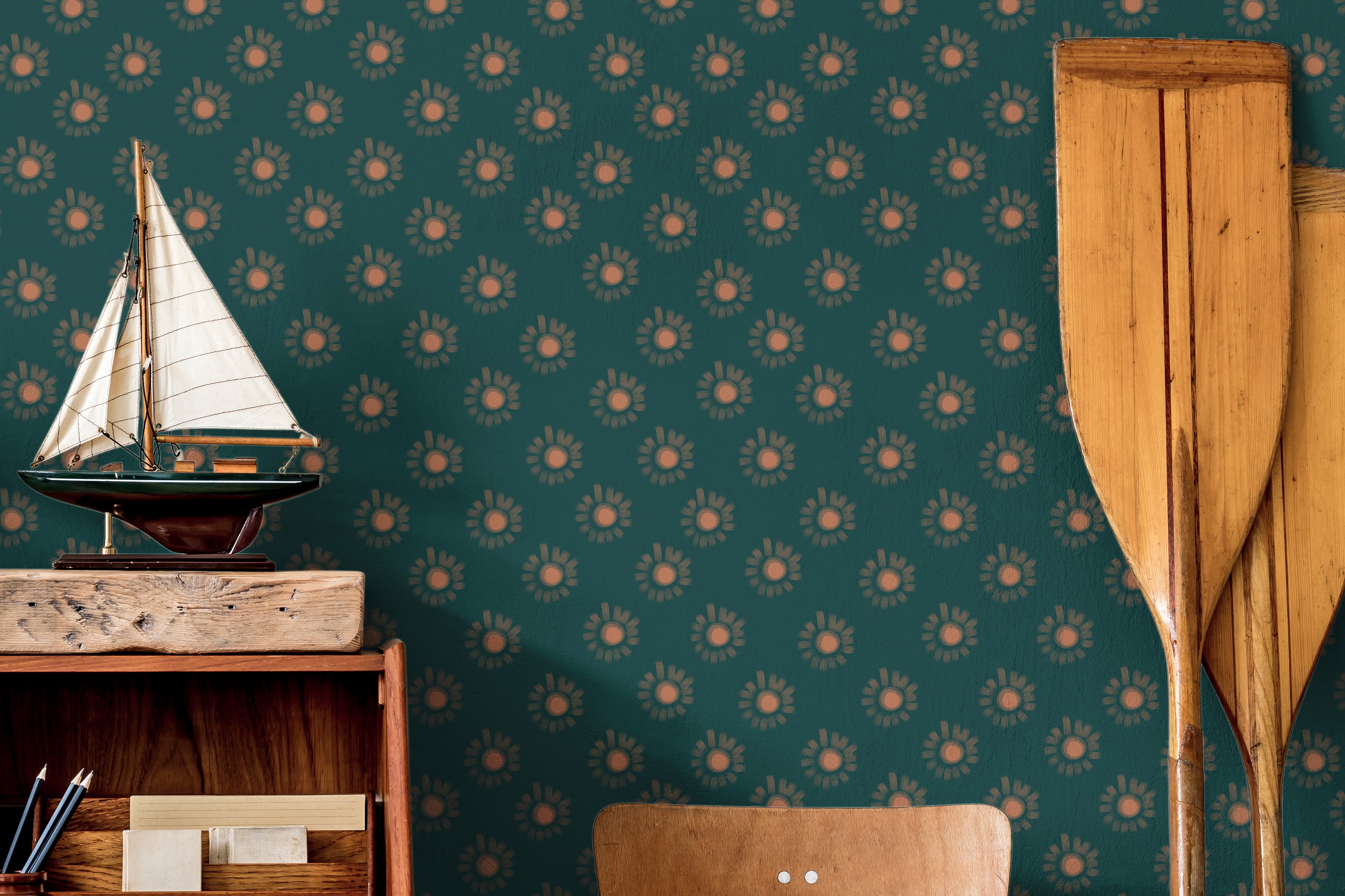 Sun glows firefly style on dark teal background in nautical themed boys room
