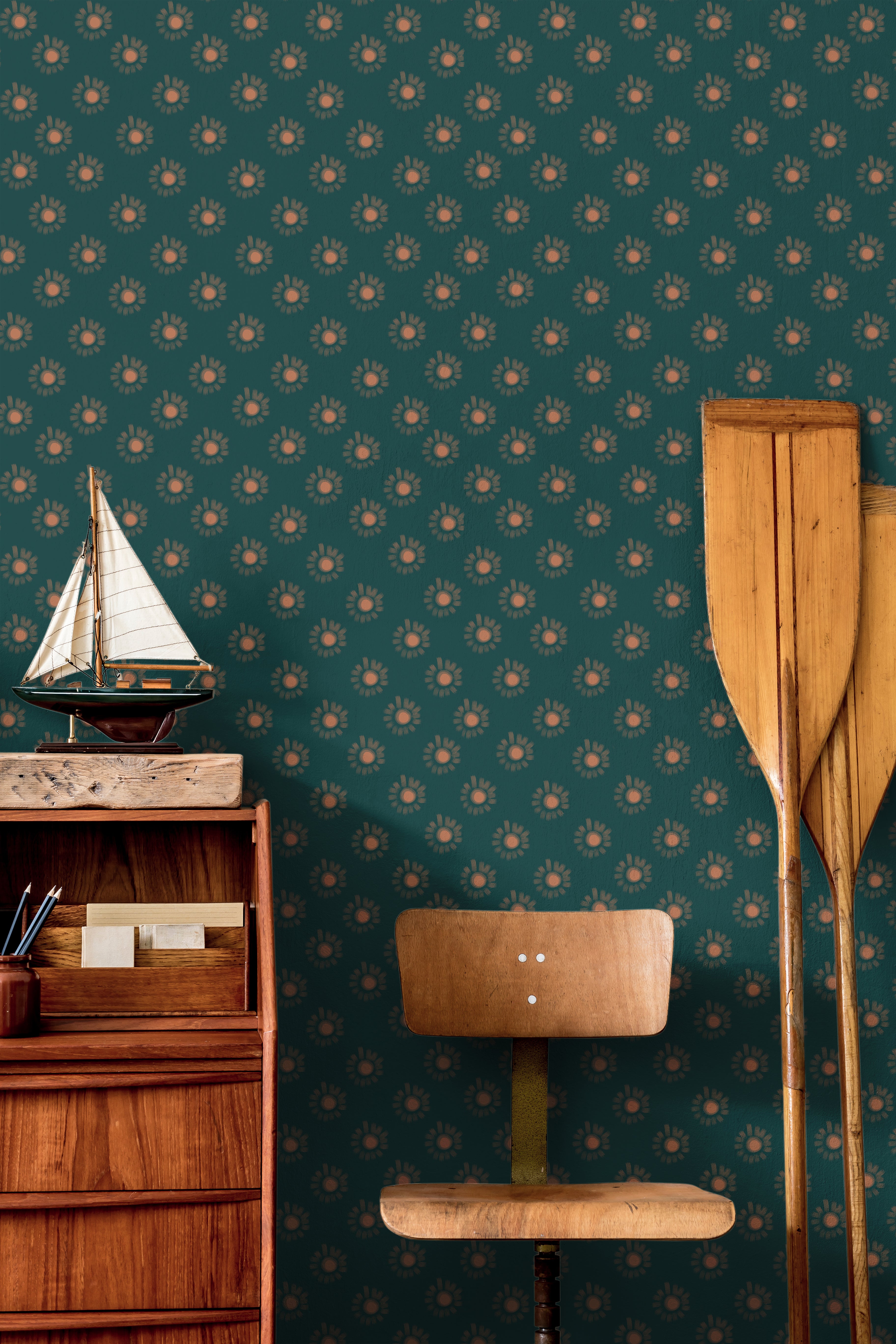 Sun glows firefly style on dark teal background in nautical themed boys room
