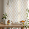 Geometric multicolored golden honeycomb patterns on a white background in a well lit bright interior dining room