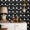 Black and white Geometric florals that look like skulls behind modern day bar credenza