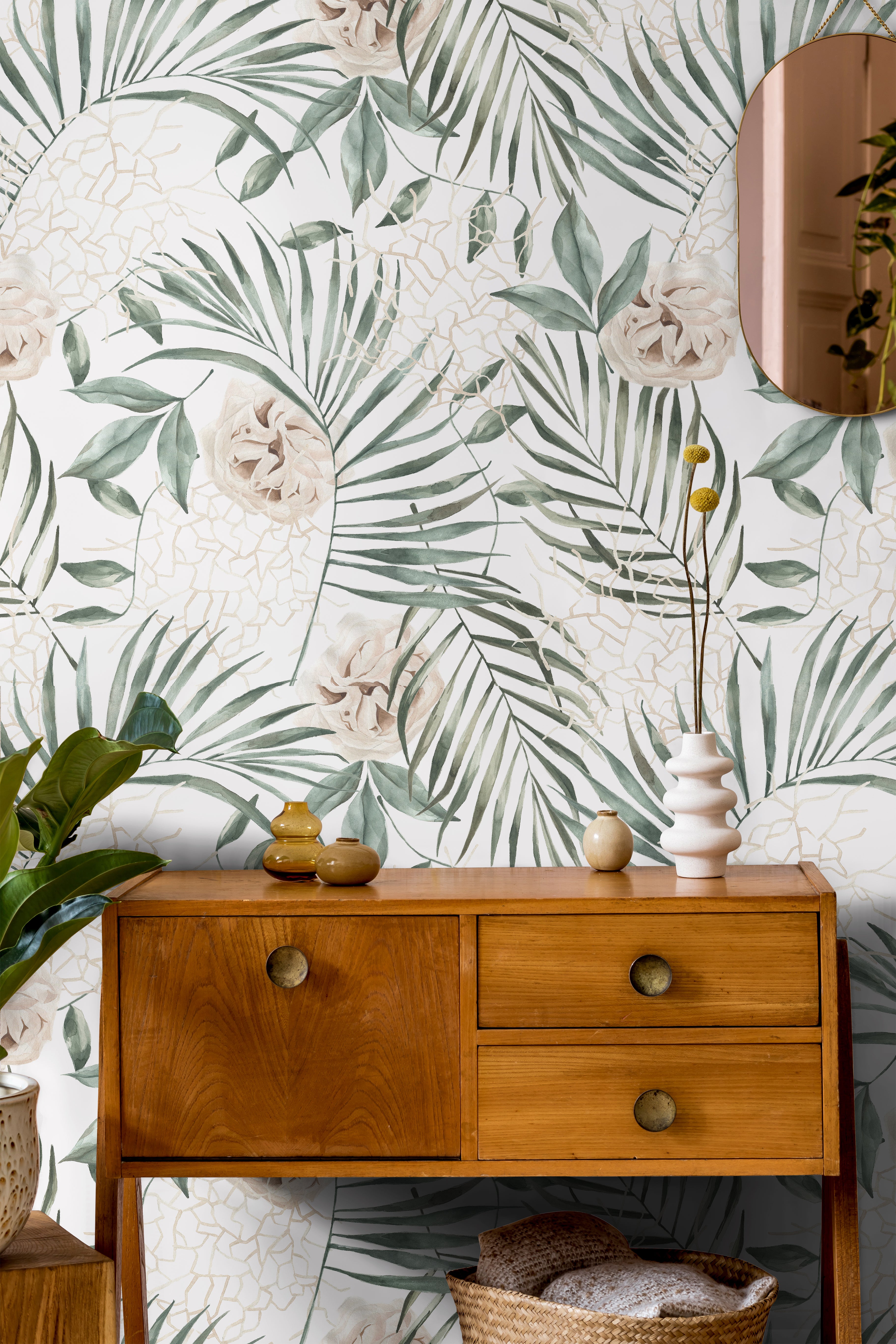 Tropical palm leaves with white background in living area styled with warm wooden accents