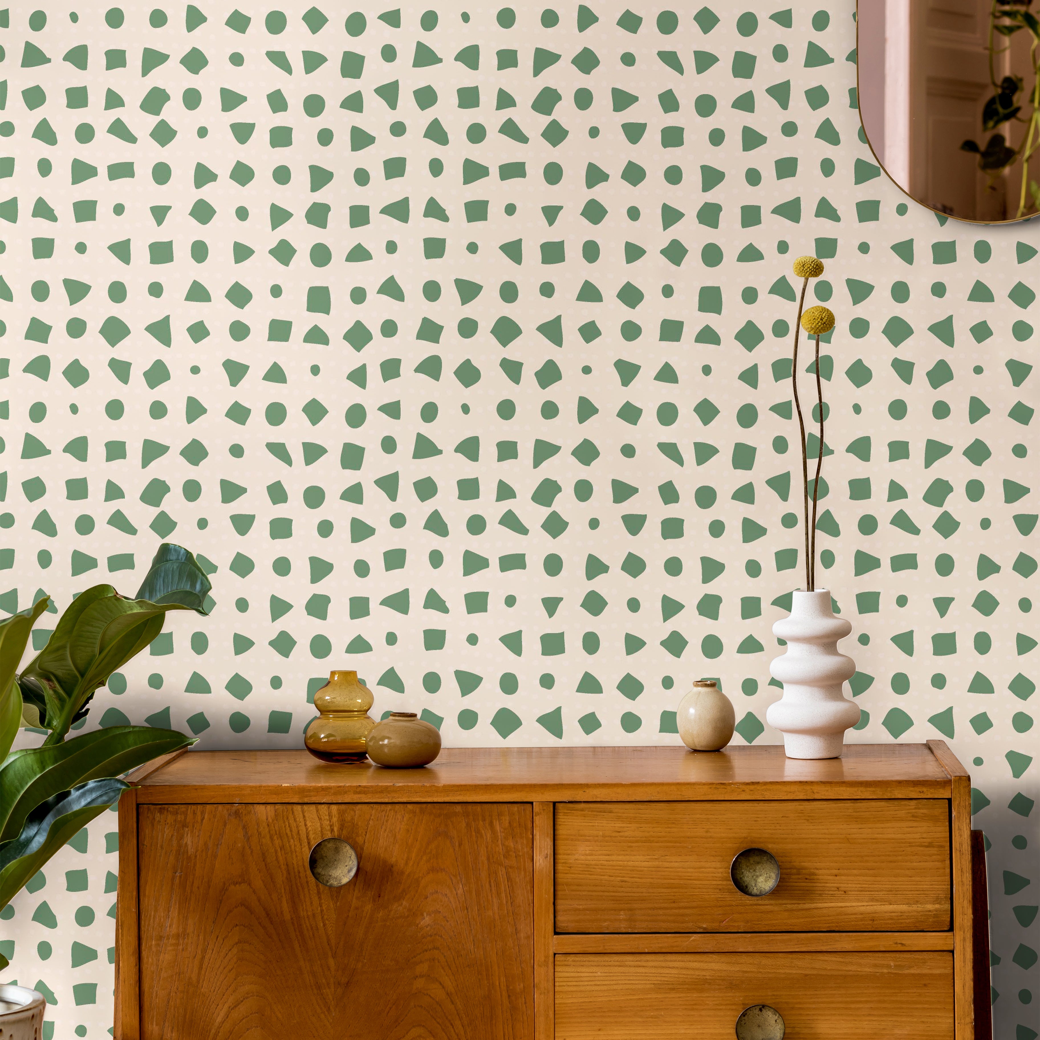 Abstract green shapes on cream in brightly lit interior living space
