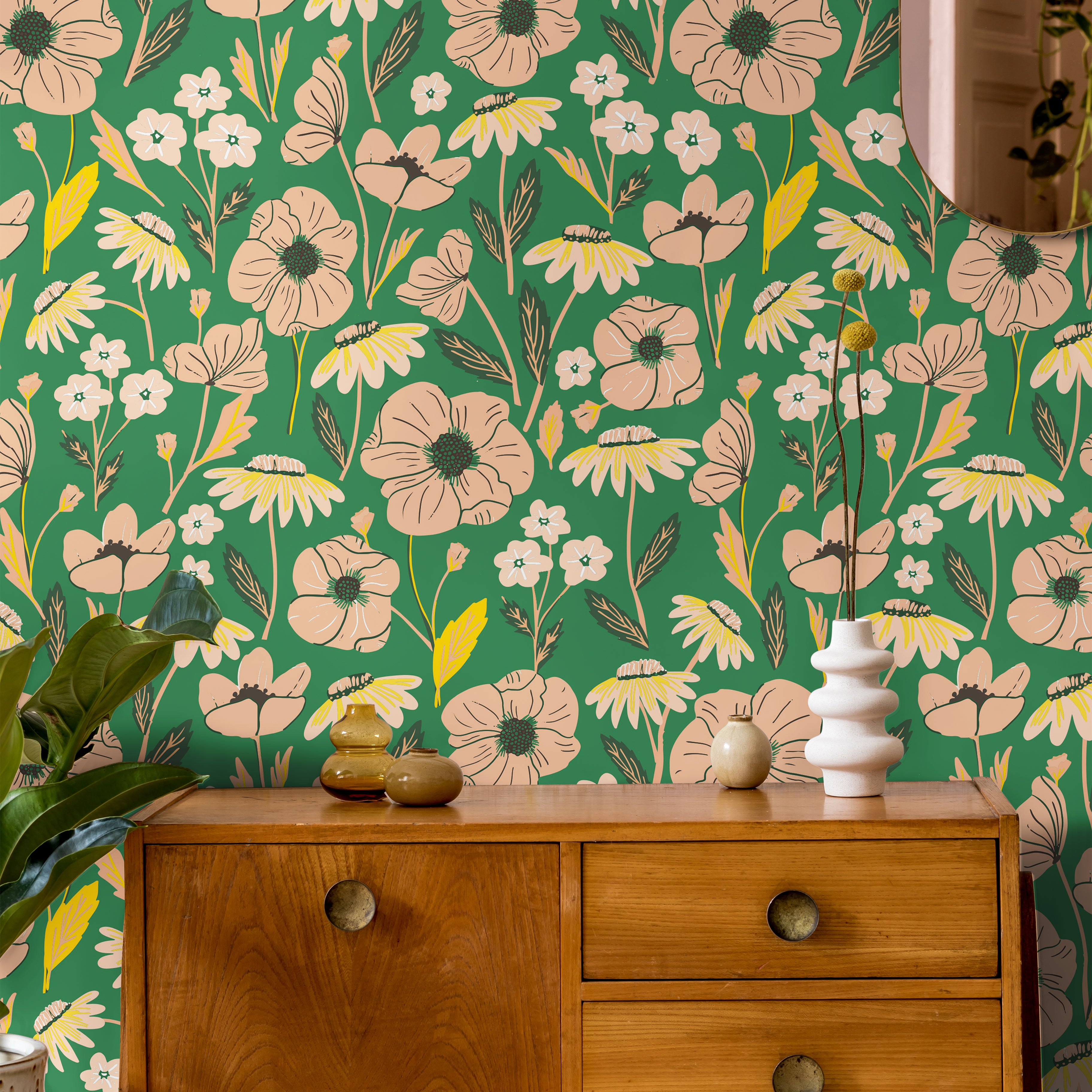 Blush pink florals on bright green background styled with warm wood tones and 
