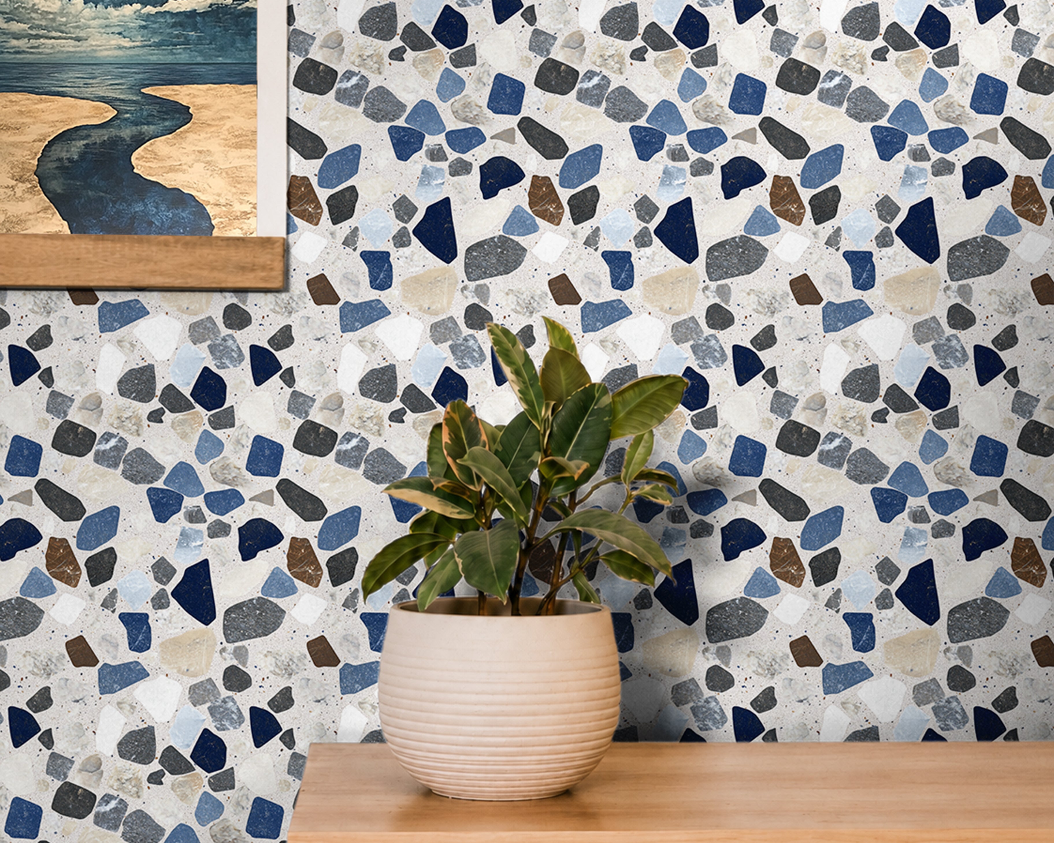 refined terrazzo-inspired with a balanced mix of deep navy, soft blues, warm browns, and neutral stone fragments set against a light base maintaining a clean, structured look that feels both modern and timeless.