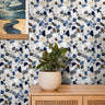 refined terrazzo-inspired with a balanced mix of deep navy, soft blues, warm browns, and neutral stone fragments set against a light base maintaining a clean, structured look that feels both modern and timeless.
