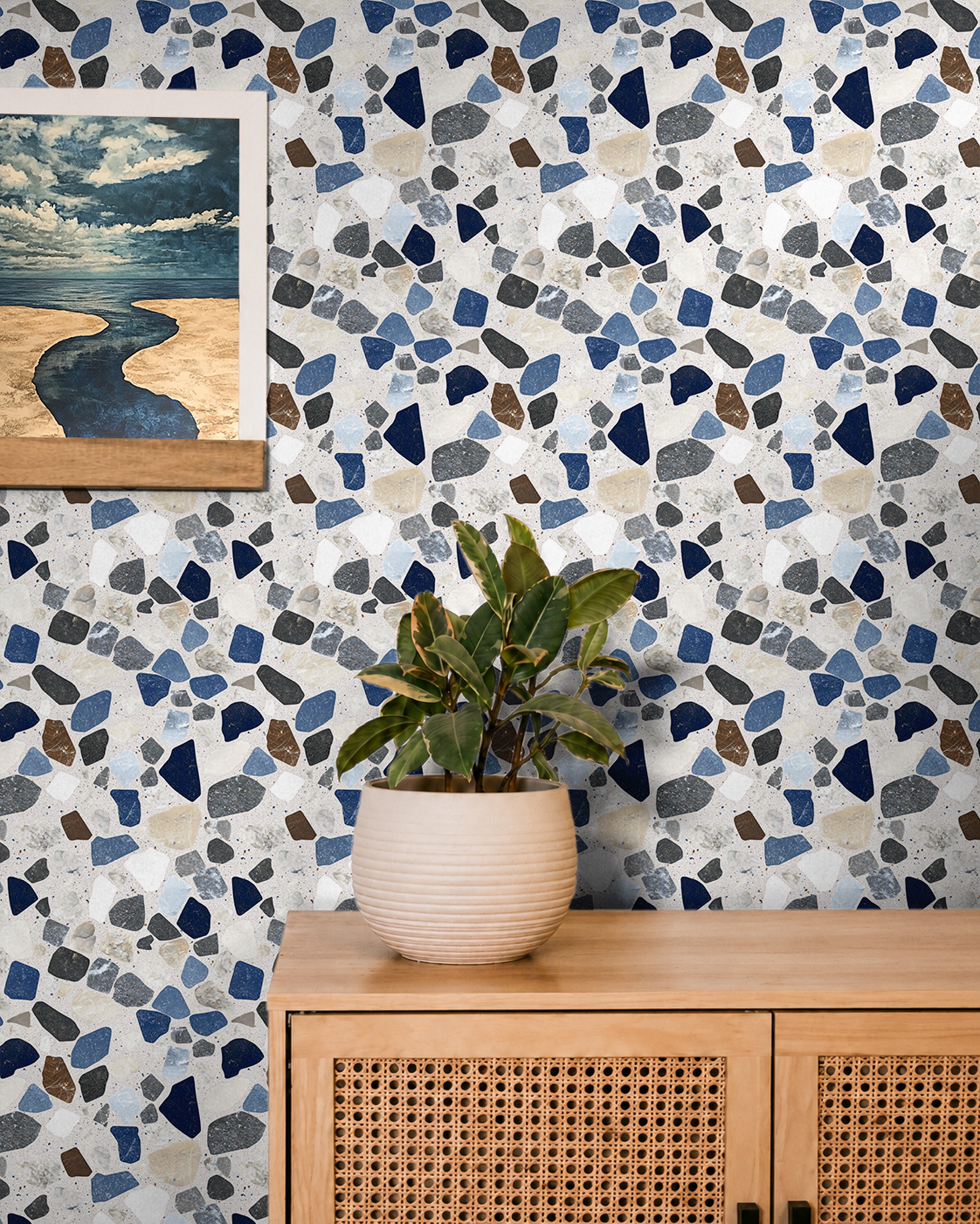 refined terrazzo-inspired with a balanced mix of deep navy, soft blues, warm browns, and neutral stone fragments set against a light base maintaining a clean, structured look that feels both modern and timeless.