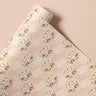 Harlow Hill contact paper roll featuring blush background with white daisies and sage-green stems by James & Colors