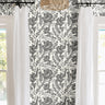  hand-drawn florals in elegant black ink. Each sweeping petal and leaf feels sketched by an artist’s hand, creating a graceful rhythm of linework that flows across a warm ivory backdrop. 