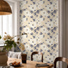 Ivory peonys with dark blue leaves styled in warm dining room