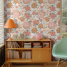 Large pink and orange florals styled in mid century modern living space
