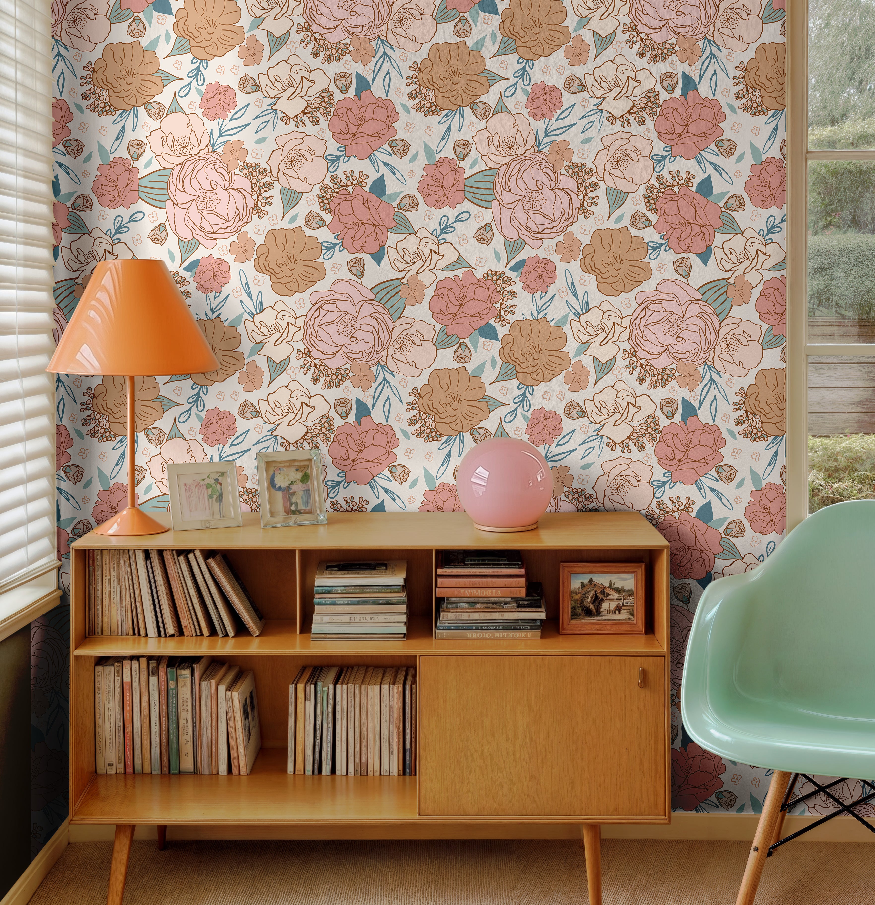 Large pink and orange florals styled in mid century modern living space