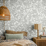 Gray leaves busy wallcovering styled in boho interior