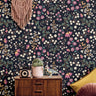 Purple and white flowers on midnight blue background styled in boho teens room