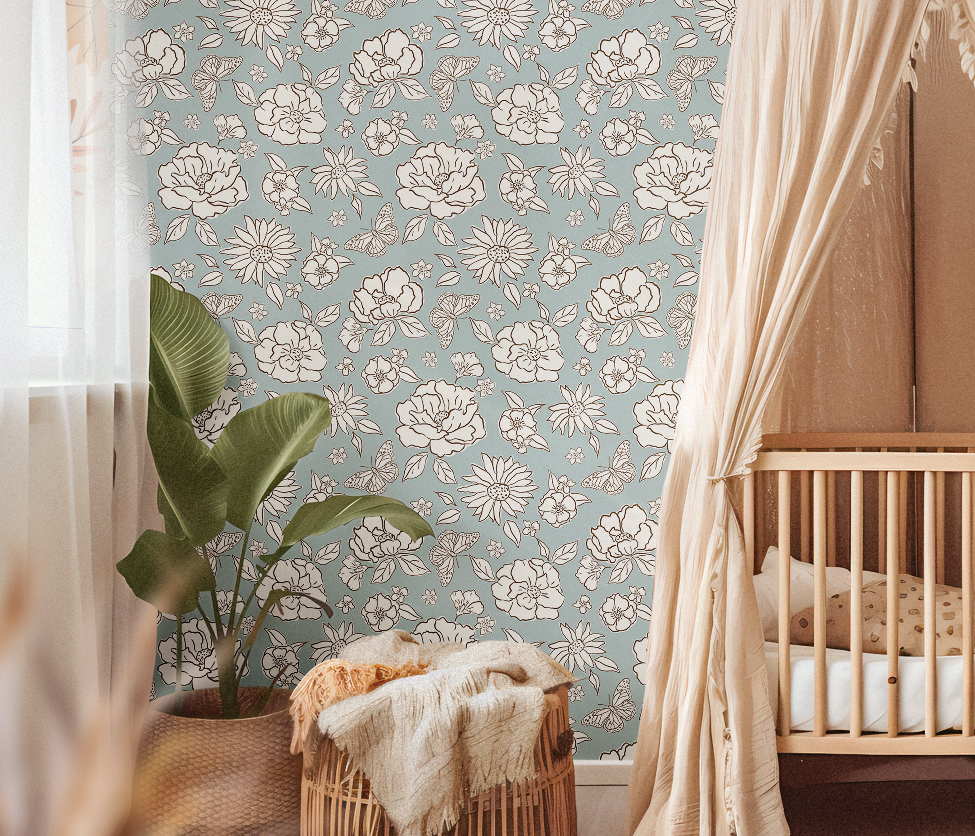 White florals on muted blue background in boho neutral nursery