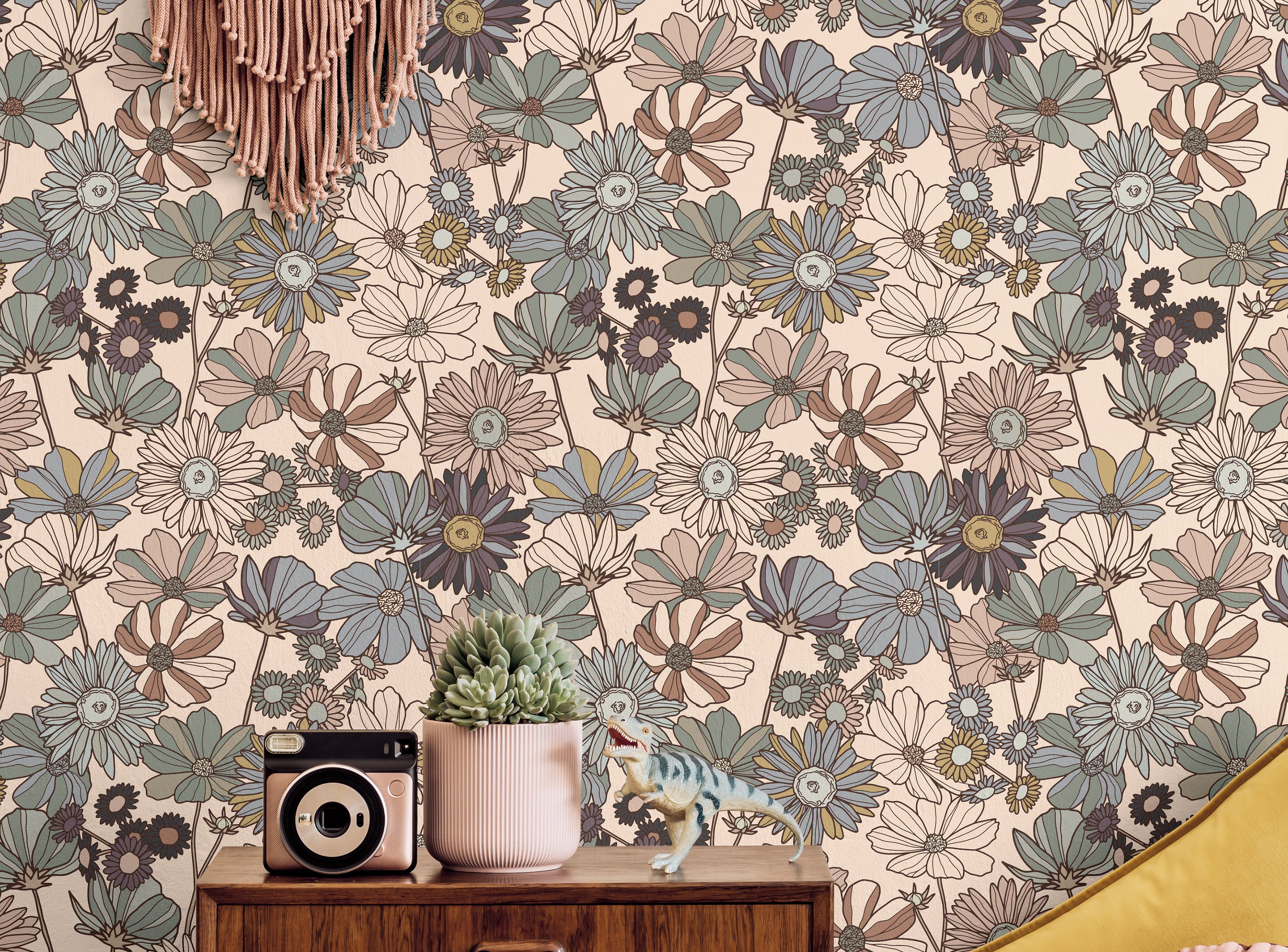 Muted boho blue pink and yellow flowers styled in a boho living room