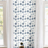Navy and white sand dollar geometric print in brightly lit white living room