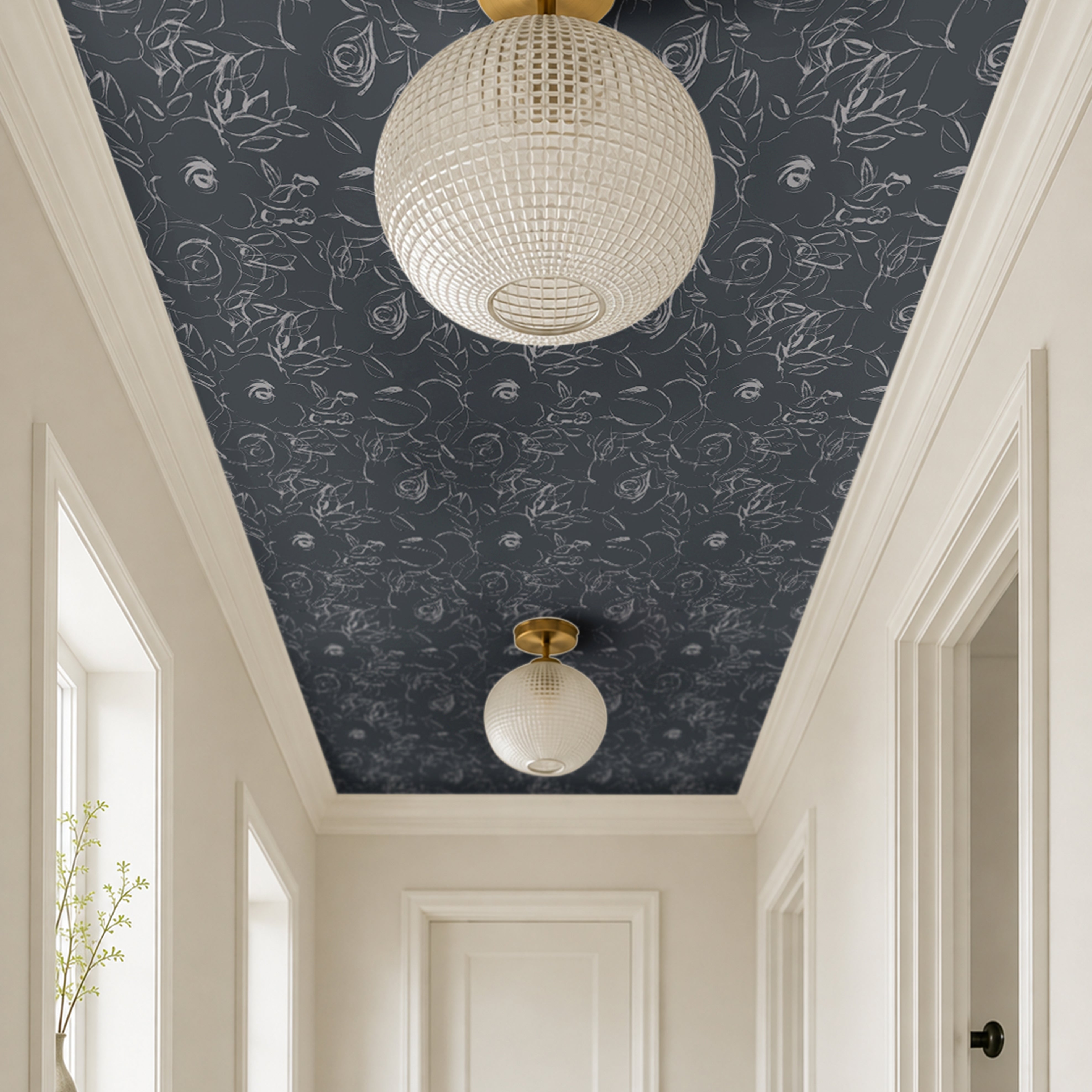 dark blue background with white floral sketches in bright large airy white hallway