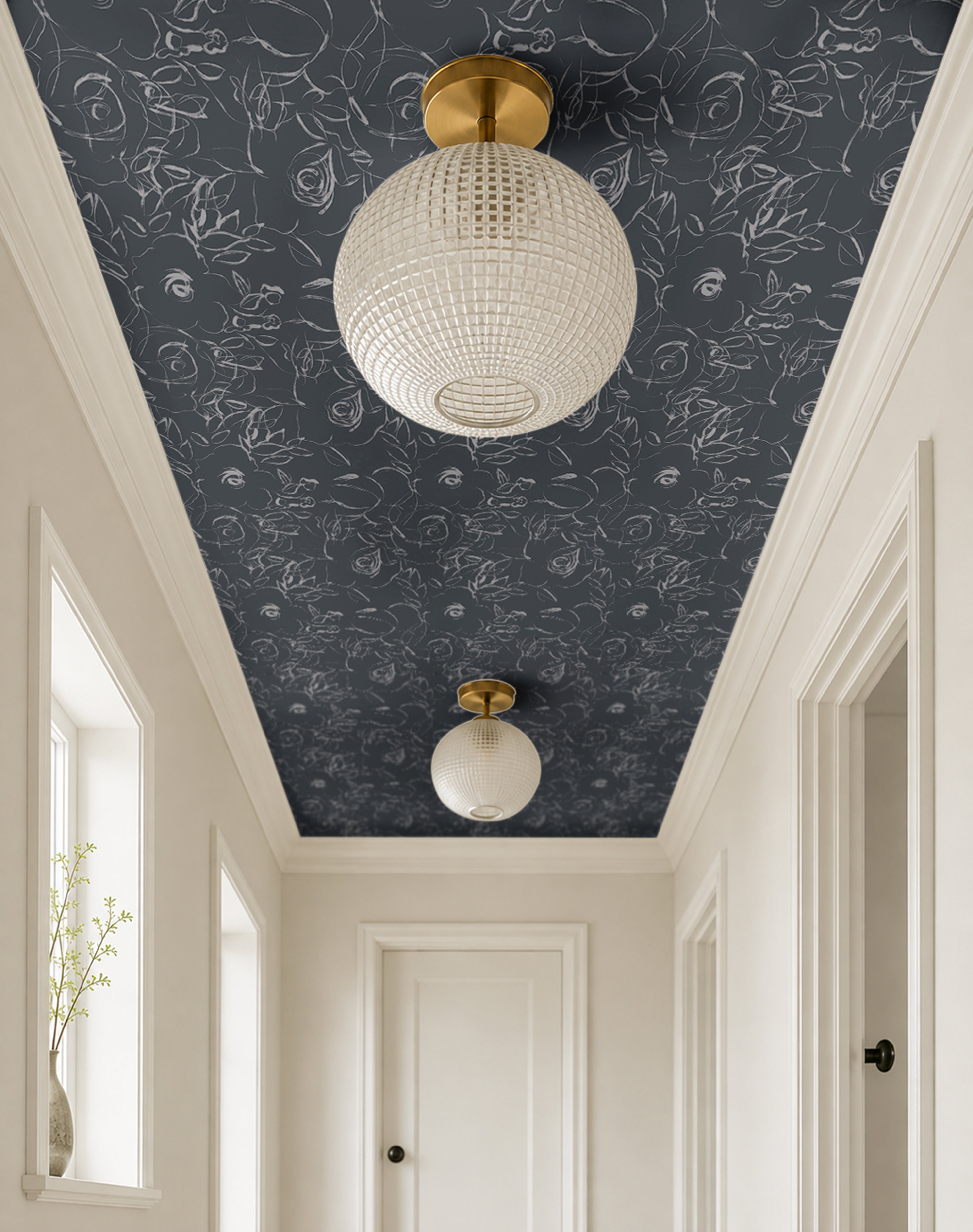 dark blue background with white floral sketches in bright large airy white hallway