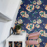 oversized orange and beige peony booms on dark navy background in modern home office