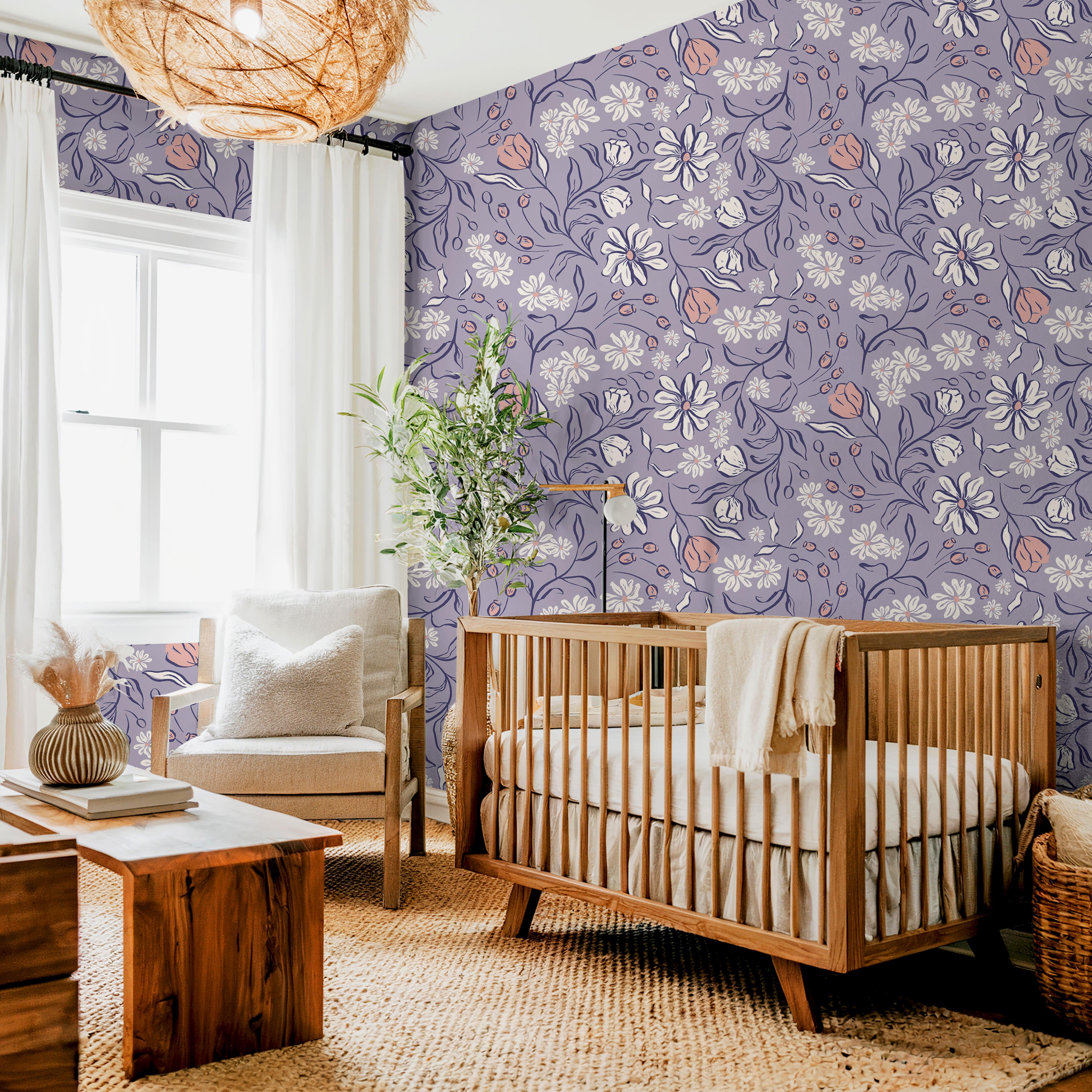 Lavender floral wallpaper in a bright nursery with white crib, rattan accents, and soft pink and white flowers – James and Colors pattern 1653