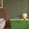 Olive green wallpaper with cream chevrons in a geometrical wave pattern in a colorful kids bedroom