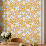 large white florals with orange leaves and a yellow-orange background with painted textures
