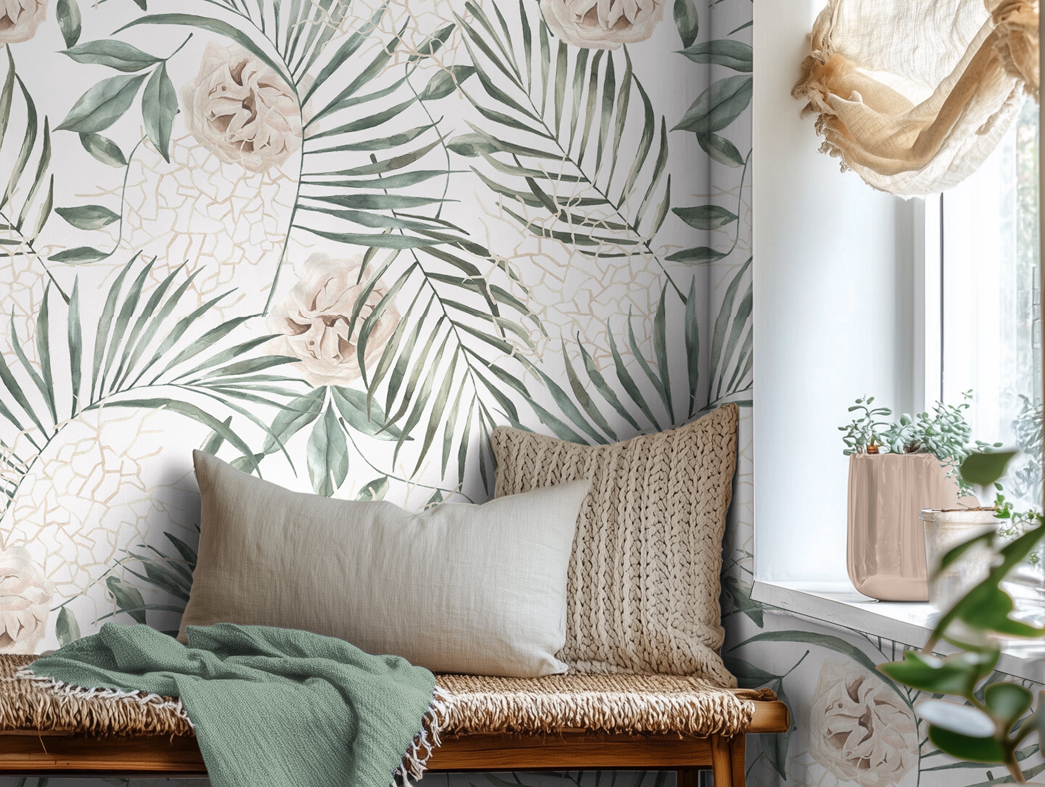 Oversized tropical palm leaves with white background styled in an airy reading nook