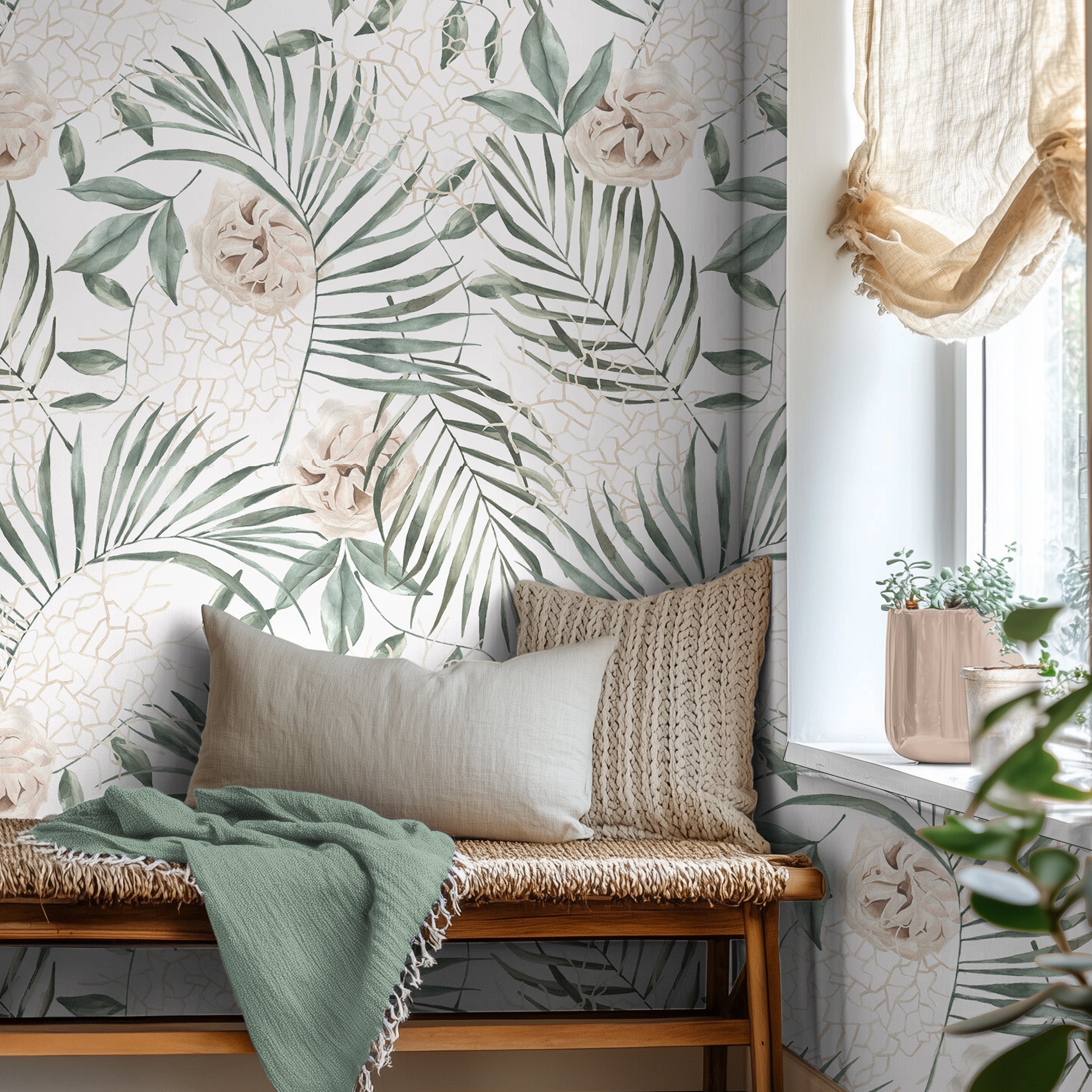 Oversized tropical palm leaves with white background styled in an airy reading nook
