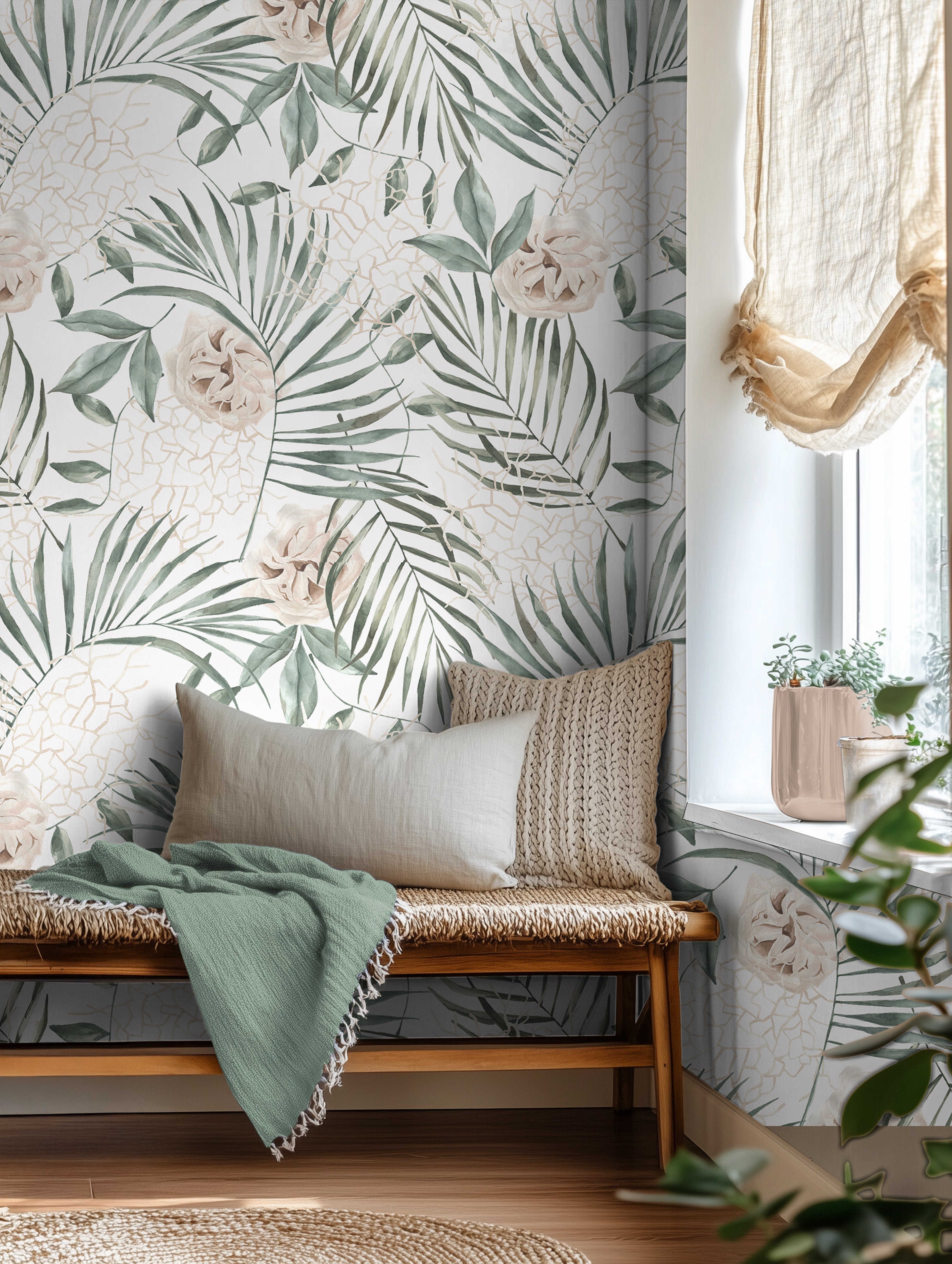 Oversized tropical palm leaves with white background styled in an airy reading nook