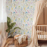 Blue yellow and pink fairy wallcovering in brightly lit nursery