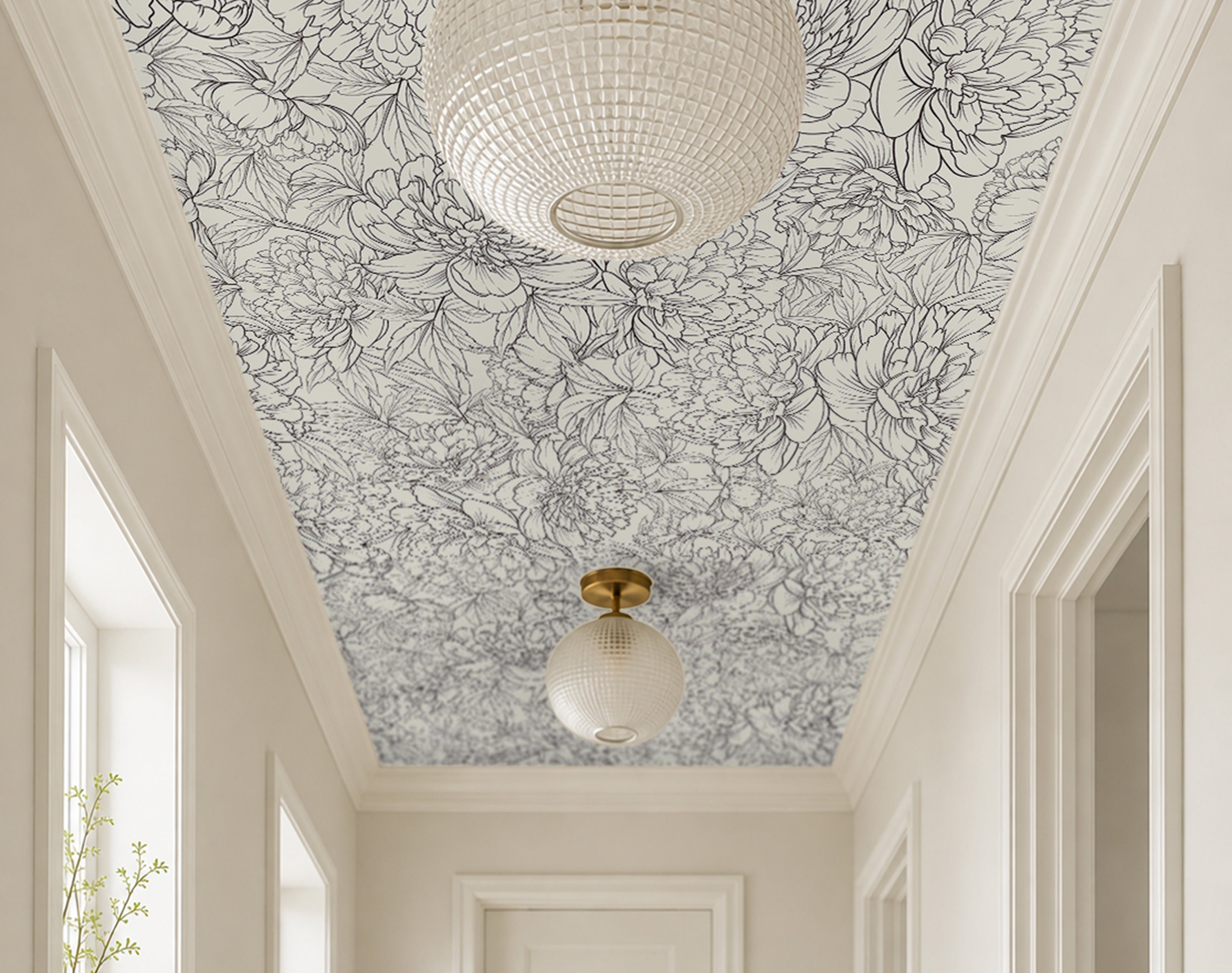 oversized botanical blooms drawn in graceful charcoal linework over a smooth ivory background in modern white hallway 
