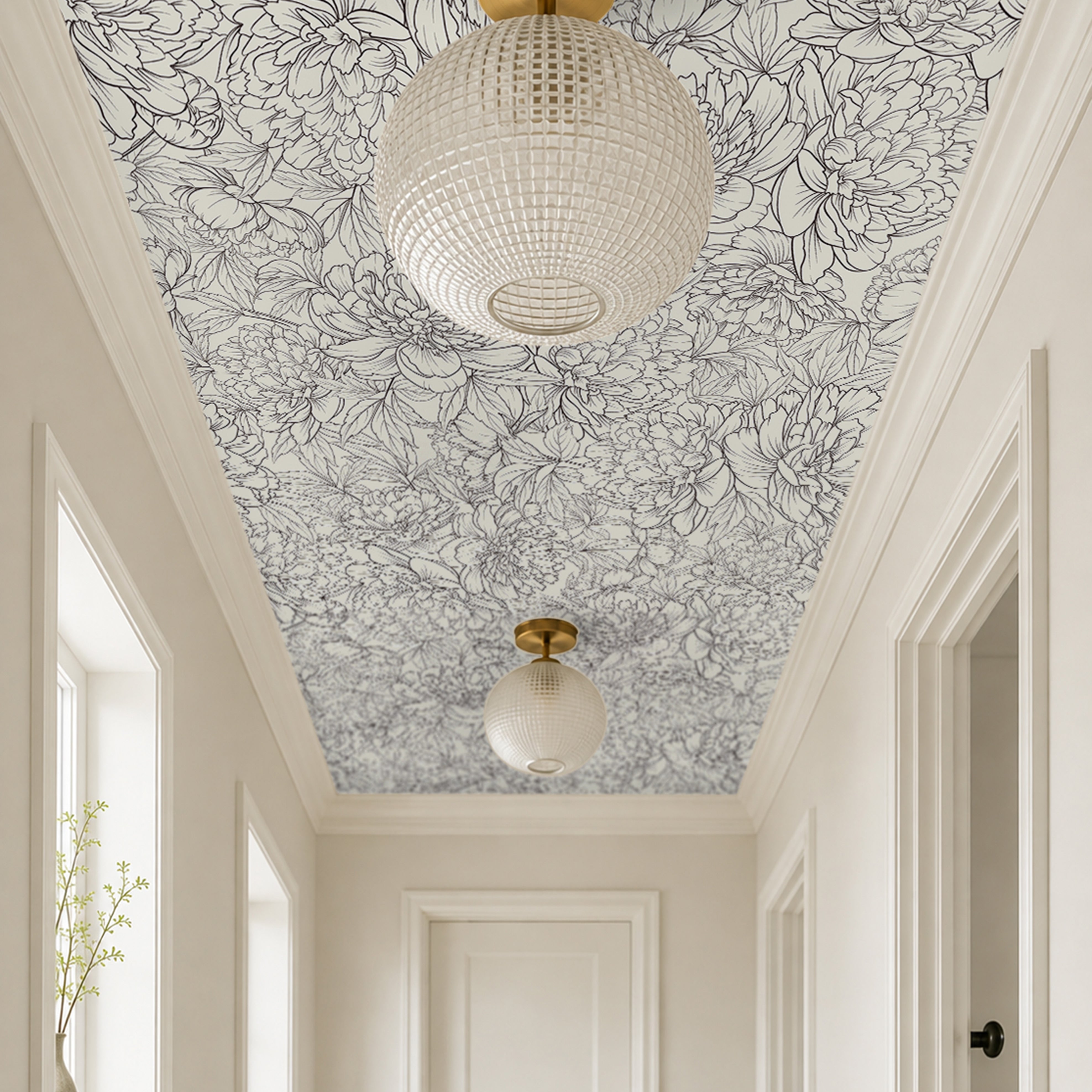 oversized botanical blooms drawn in graceful charcoal linework over a smooth ivory background in modern white hallway 