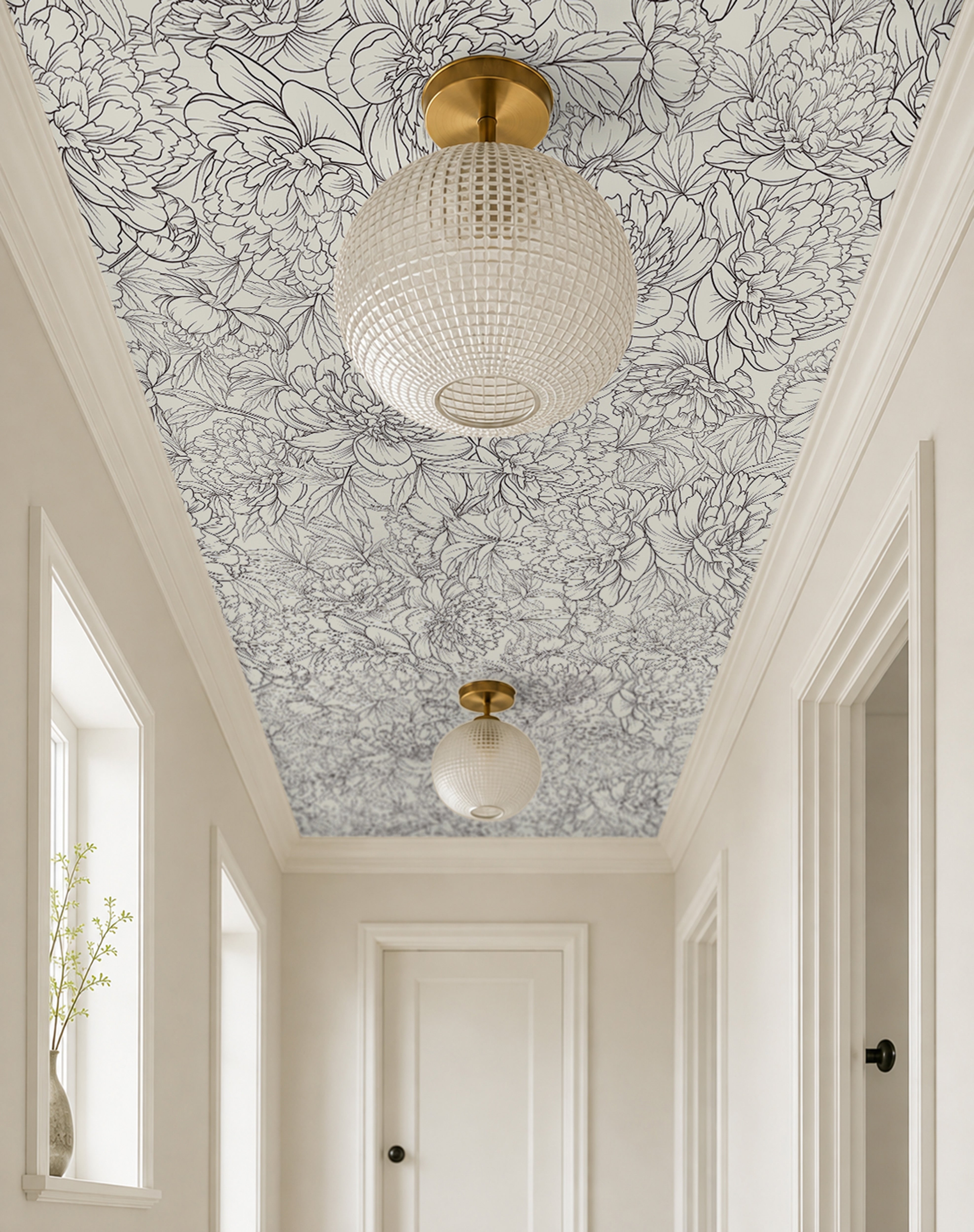 oversized botanical blooms drawn in graceful charcoal linework over a smooth ivory background in modern white hallway 